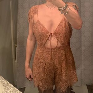 Pink lace romper v-neck and off the shoulder Size M - Never been worn!